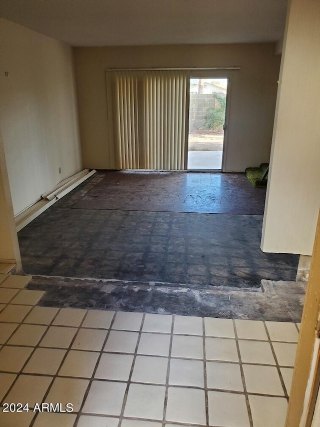 unfurnished room featuring tile patterned floors