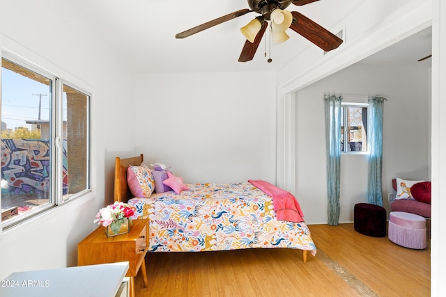 bedroom featuring wood-type flooring and ceiling fan