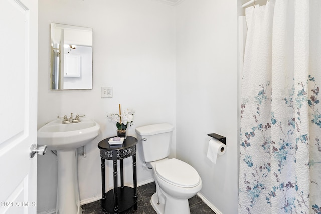 bathroom with a shower with shower curtain, toilet, and tile patterned floors