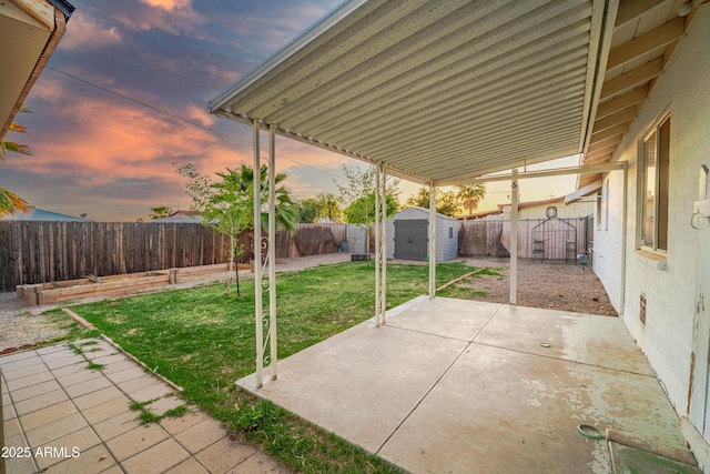 117 Peretz Cir, Morristown, AZ 85342 - view of patio / terrace with a fenced backyard, a shed, and an outdoor structure