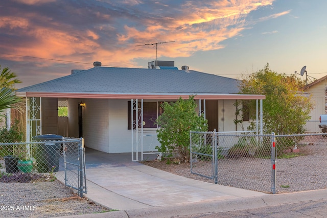 117 Peretz Cir, Morristown, AZ 85342 - country-style home with an attached carport, a gate, fence, and concrete driveway