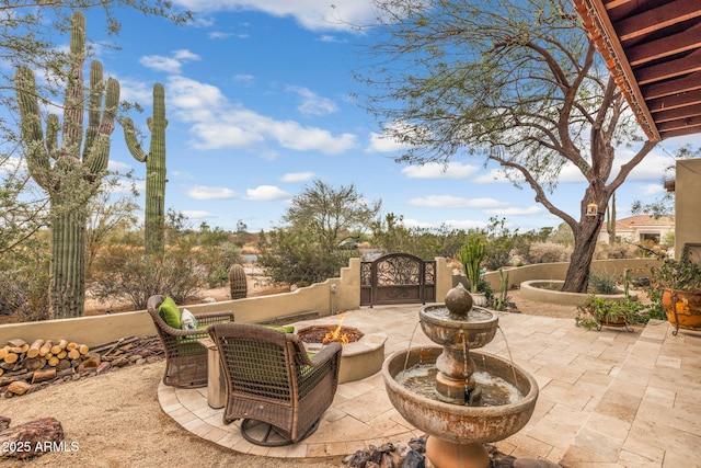 view of patio featuring a gate and fence