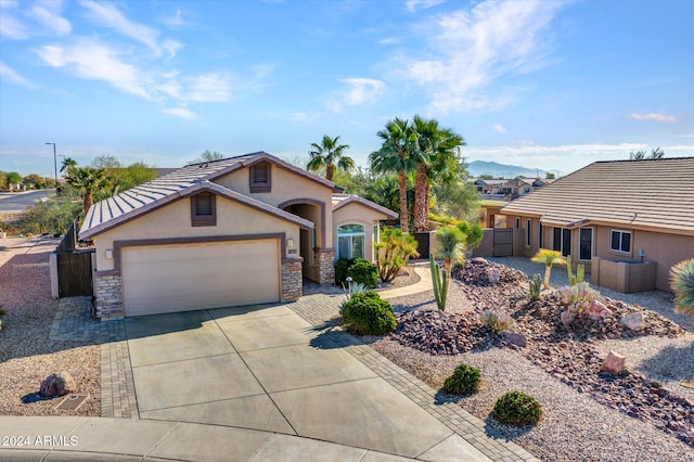 view of front of house featuring a mountain view and a garage