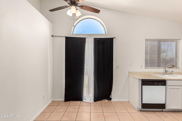 kitchen featuring white cabinets, sink, dishwasher, lofted ceiling, and light tile patterned flooring