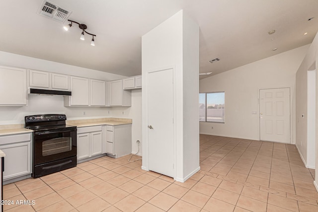 kitchen with light tile patterned floors, vaulted ceiling, white cabinetry, and black electric range oven