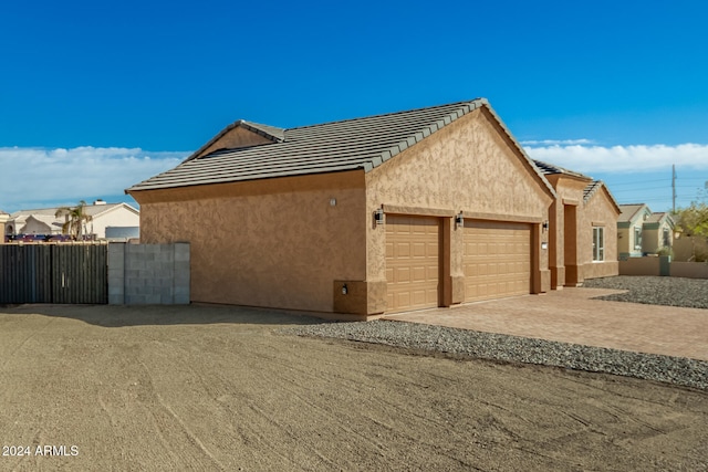 view of home's exterior with a garage