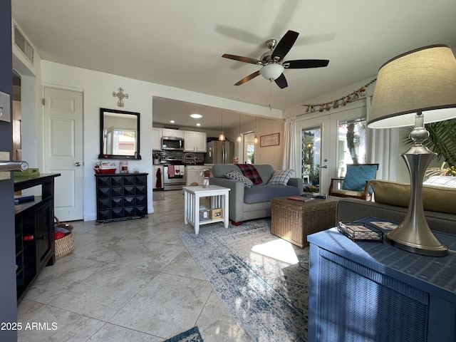 living area featuring recessed lighting, visible vents, a ceiling fan, and french doors