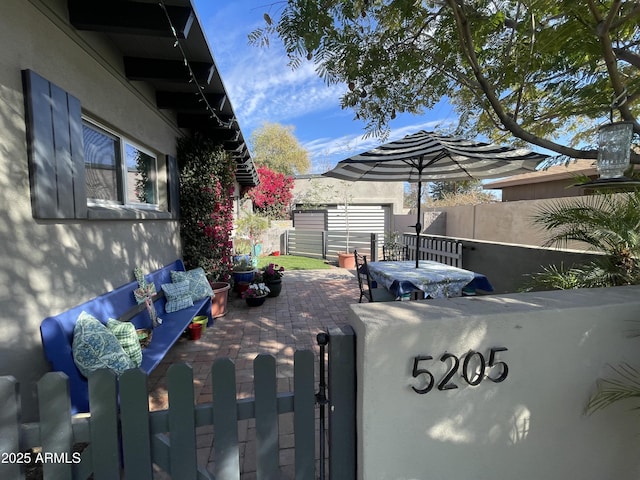 view of parking featuring a fenced backyard