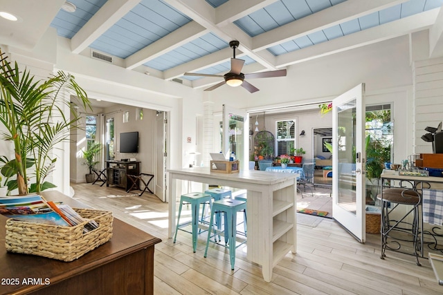 kitchen featuring a healthy amount of sunlight, visible vents, and beam ceiling