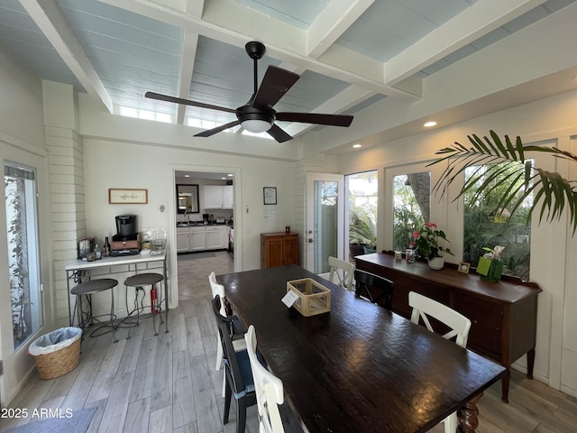 dining space featuring a ceiling fan, recessed lighting, beam ceiling, and light wood-style floors