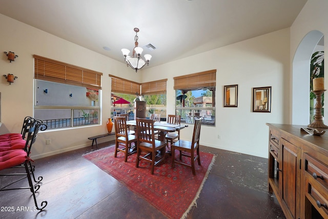 dining area with a notable chandelier