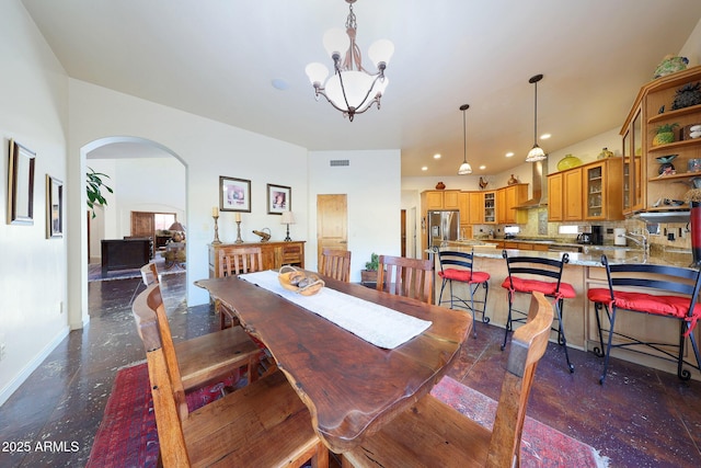 dining space with an inviting chandelier