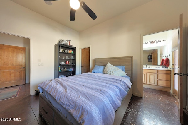 bedroom with ceiling fan, lofted ceiling, and ensuite bathroom