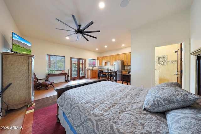 bedroom featuring stainless steel refrigerator