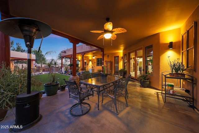 patio terrace at dusk with ceiling fan