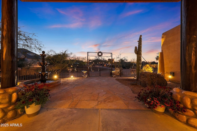 view of patio terrace at dusk