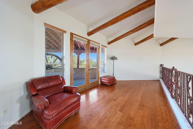 sitting room with french doors, hardwood / wood-style floors, and beamed ceiling