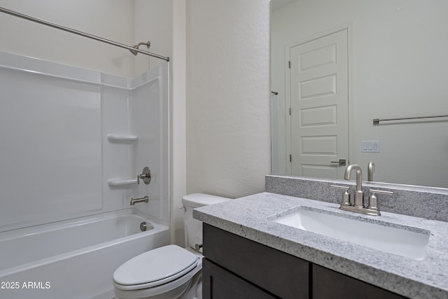 bathroom featuring bathing tub / shower combination, toilet, and vanity