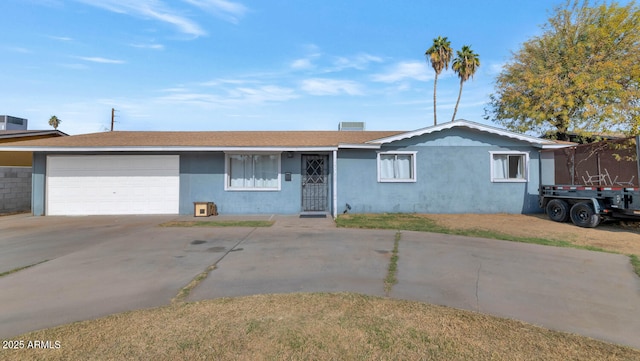 single story home featuring a garage