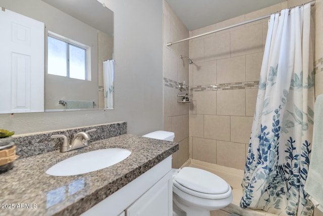 bathroom with vanity, a shower with shower curtain, and toilet