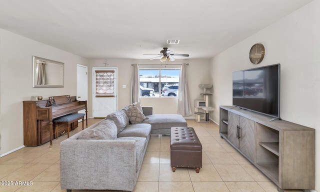 living room with ceiling fan and light tile patterned floors