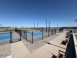 view of swimming pool featuring fence