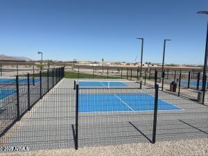 view of tennis court featuring fence