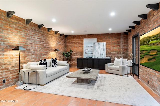 living room featuring brick wall