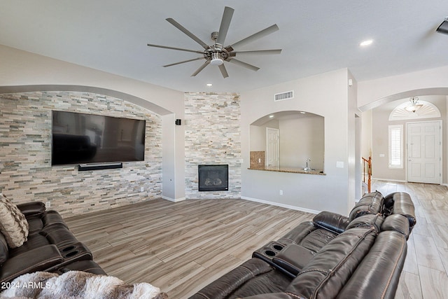 1912 E Gemini Pl, Chandler, AZ 85249 - living room with wood finished floors, ceiling fan, a fireplace, recessed lighting, and baseboards