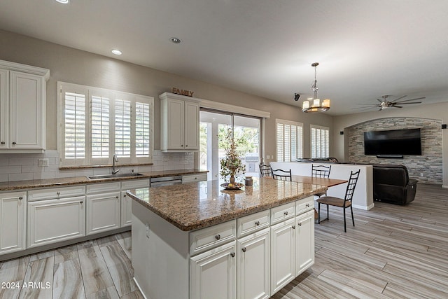 1912 E Gemini Pl, Chandler, AZ 85249 - kitchen with a sink, ceiling fan, a center island, white cabinetry, and recessed lighting