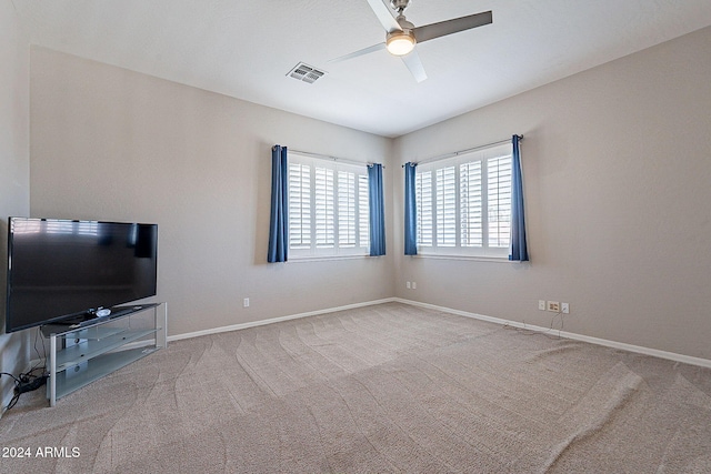 carpeted living room featuring ceiling fan