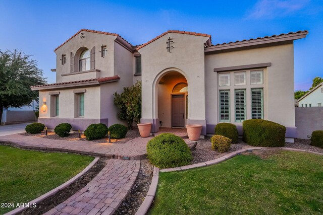 1912 E Gemini Pl, Chandler, AZ 85249 - mediterranean / spanish-style house with a front lawn, stucco siding, and a tiled roof