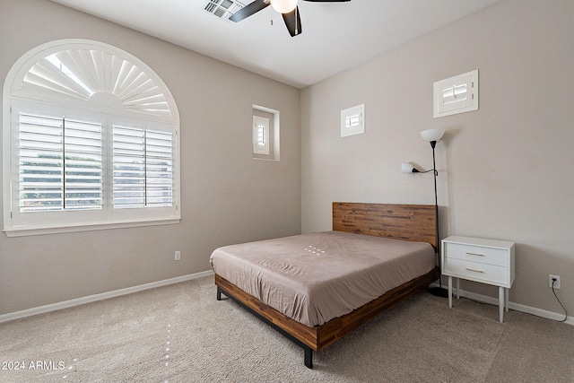 carpeted bedroom featuring ceiling fan, multiple windows, and billiards