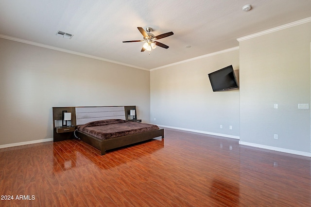 bedroom featuring ornamental molding, ceiling fan, and dark hardwood / wood-style floors