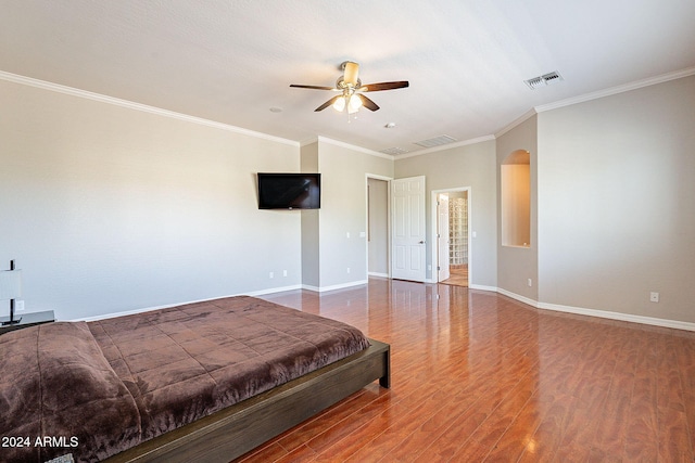 bedroom featuring ornamental molding, dark wood-type flooring, and ceiling fan