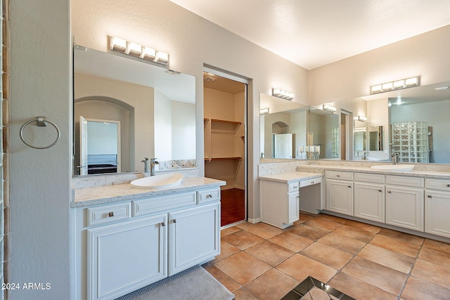 bathroom with tile patterned flooring and vanity