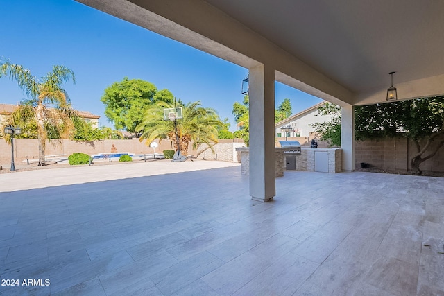 view of patio / terrace with grilling area and an outdoor kitchen