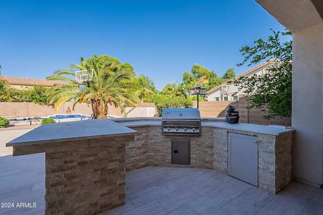 view of patio featuring grilling area and an outdoor kitchen