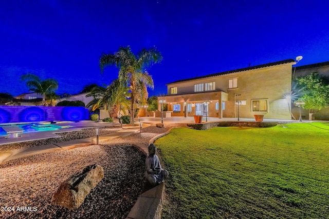 1912 E Gemini Pl, Chandler, AZ 85249 - yard at night with a patio area