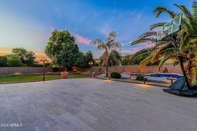 view of patio terrace at dusk