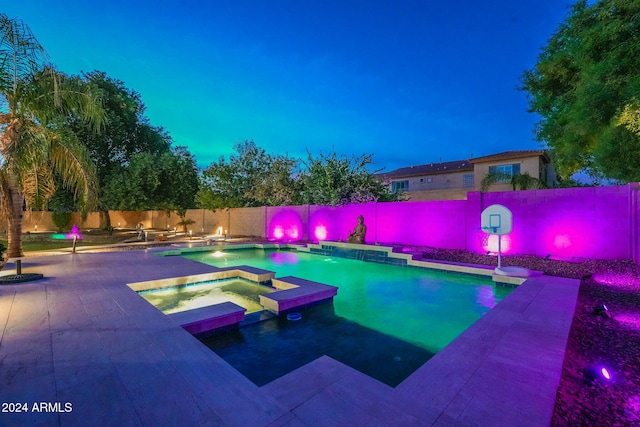 view of pool featuring an in ground hot tub