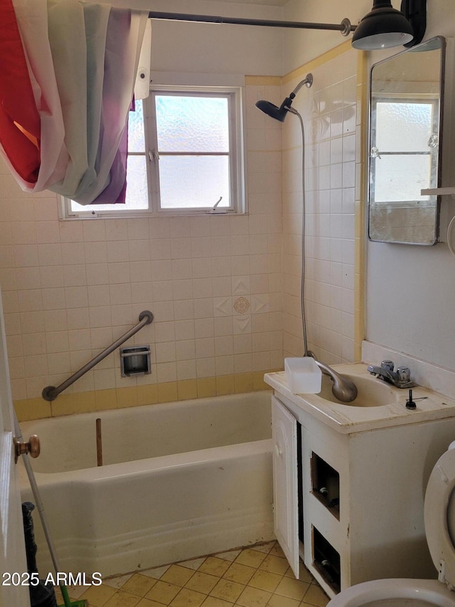 full bathroom featuring tub / shower combination, toilet, vanity, and tile patterned flooring