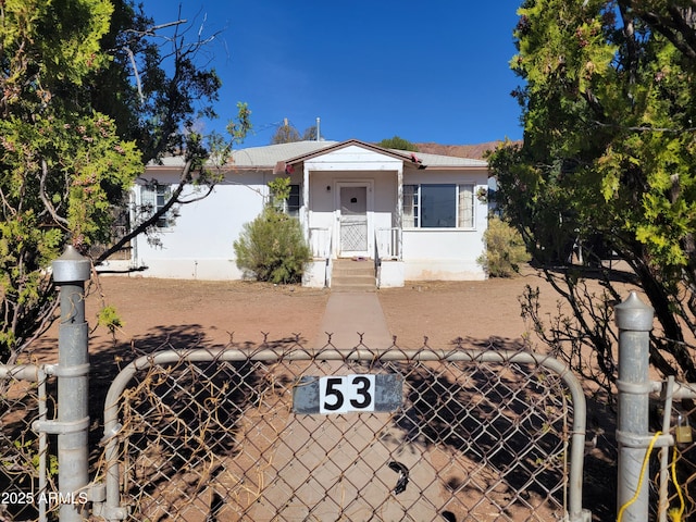 view of front of property with a gate and a fenced front yard