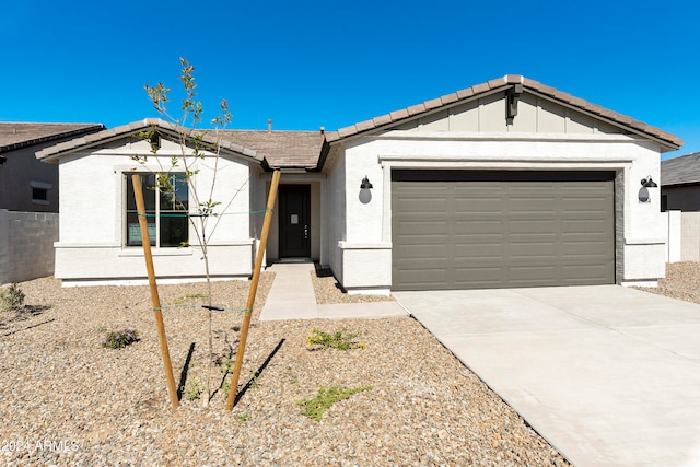 single story home featuring a garage