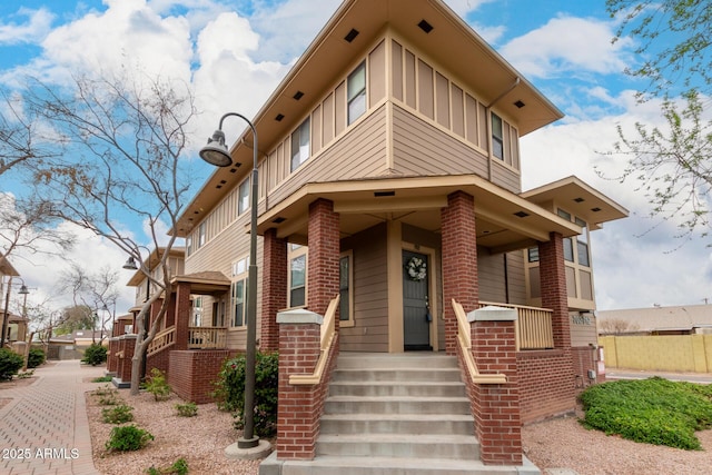 702 S Beck Ave, Tempe, AZ 85281 - view of front of house featuring board and batten siding and brick siding