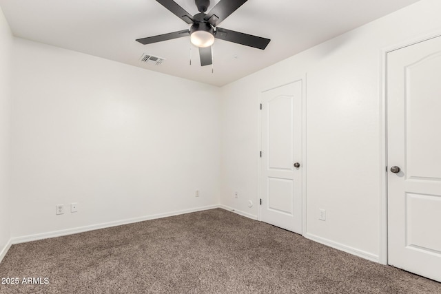 unfurnished bedroom with visible vents, a ceiling fan, baseboards, and carpet floors