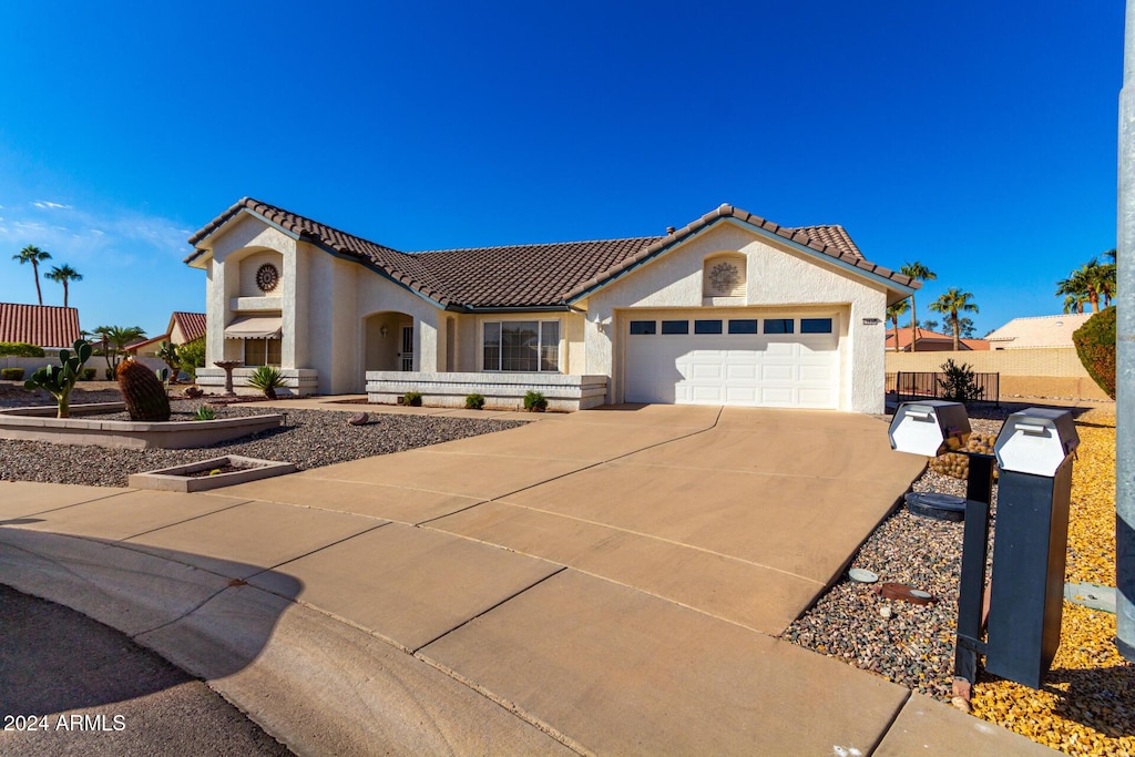 view of front of property featuring a garage