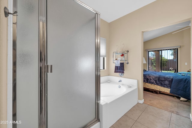bathroom featuring tile patterned floors, a shower stall, a garden tub, and connected bathroom