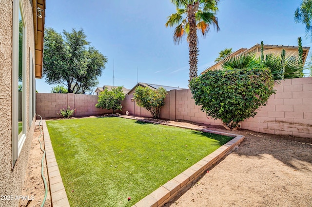 view of yard featuring a fenced backyard