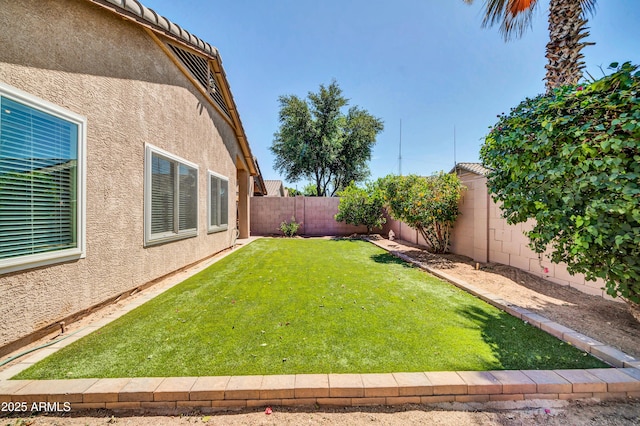 view of yard featuring a fenced backyard